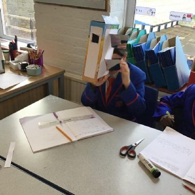 Making periscopes in Science to explore how mirrors reflect objects and light in order for us to see