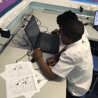 Computing - Using Scratch to code characters to dance on forever loops and for balloons to pop.