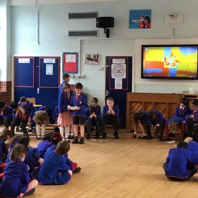 We held a whole-school assembly where we shared a story about how important it is to plant trees and look after the local environment. (2 points)